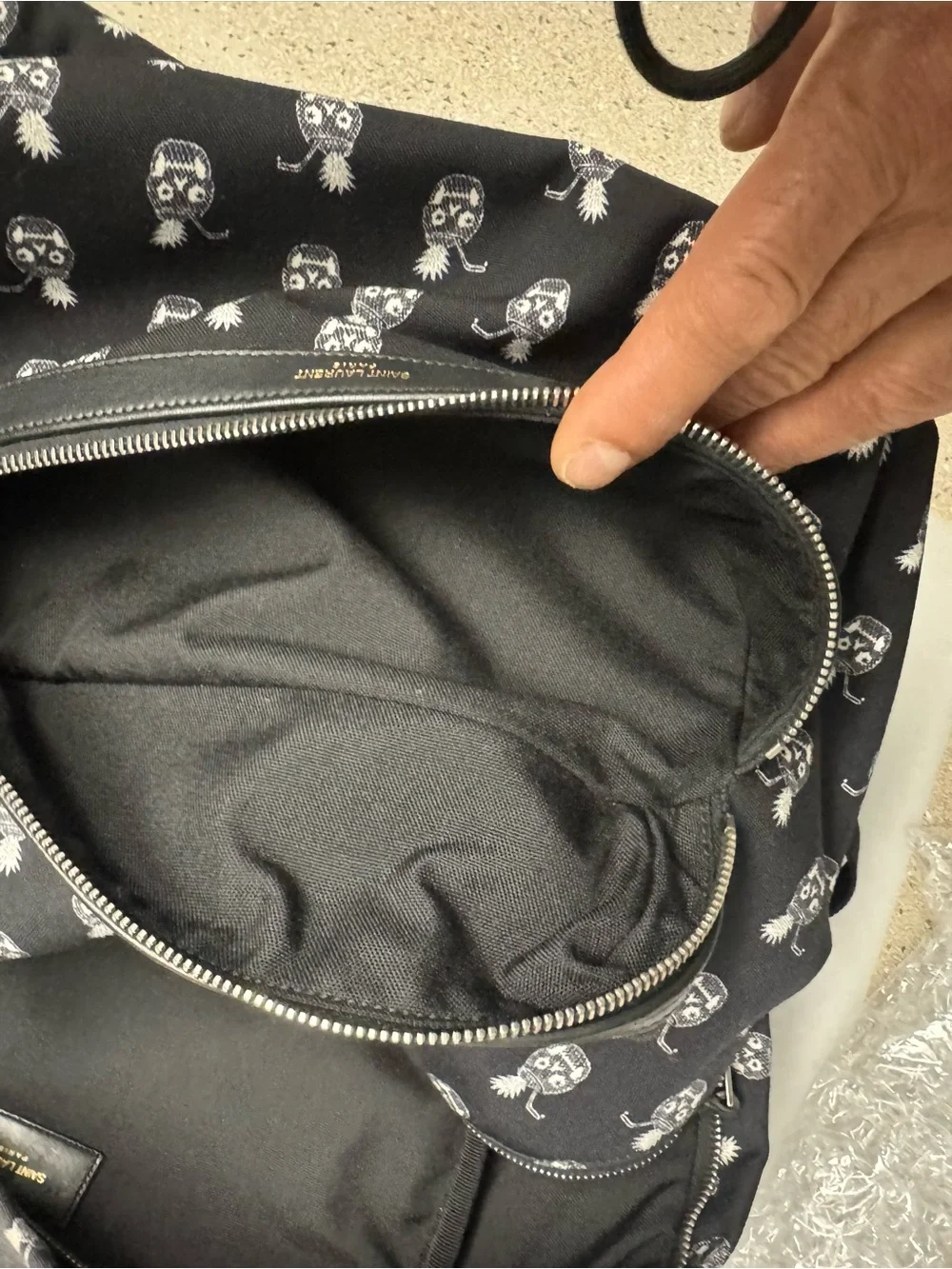 Saint Laurent Black Canvas Backpack with White Pineapple Skull Motif